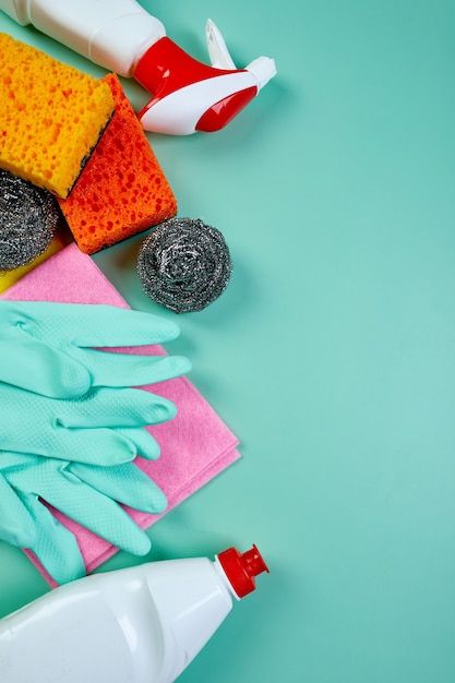 Flat lay of variety house cleaning product on blue table with copy space, cleaning set for different surfaces, detergents service concept, top view. | Premium Photo