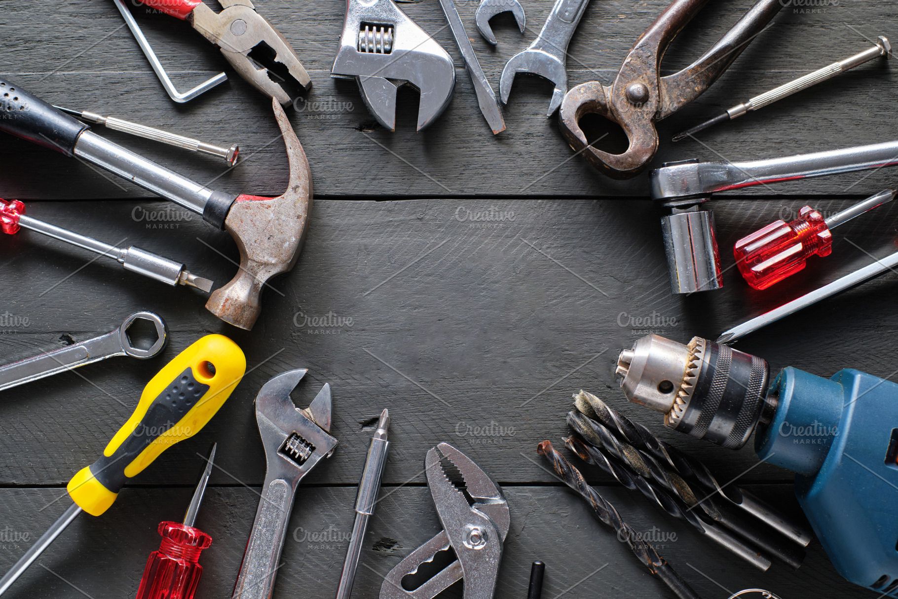 Working tools on black wooden backgr featuring tool, repair, and equipment, an Industrial Photo by alfernec