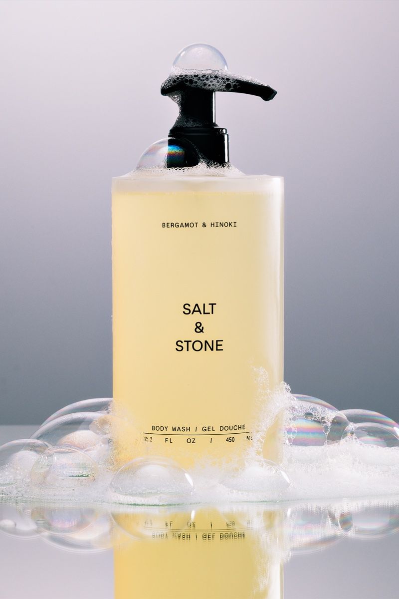 Minimalist body wash product photography stylized with soap bubbles by Studio LIIT