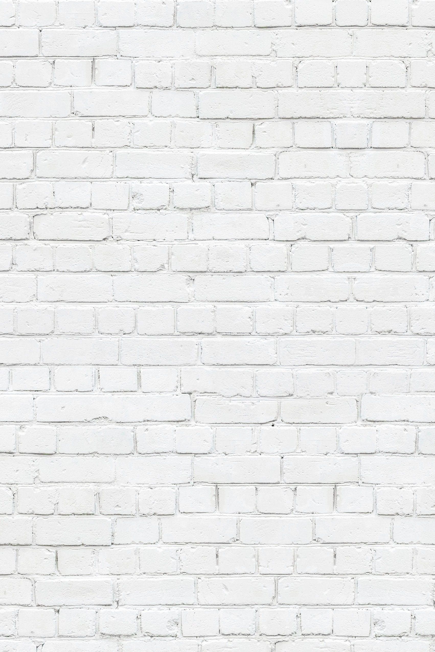 Mur de briques blanches, toile de fond pour photographies culinaires et de produits