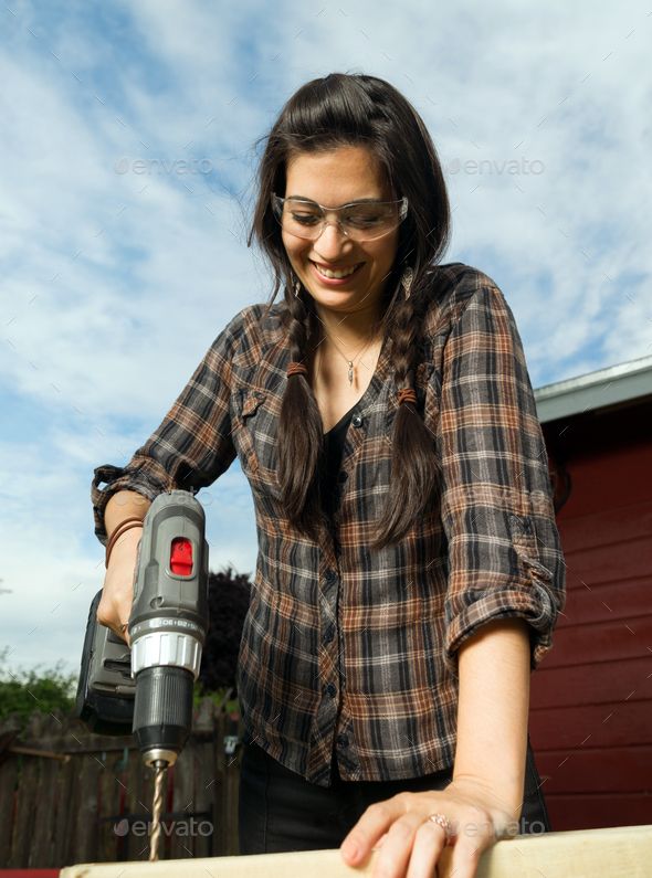 Craftsperson Woman Uses Power Screwdriver Drilling Wood Project