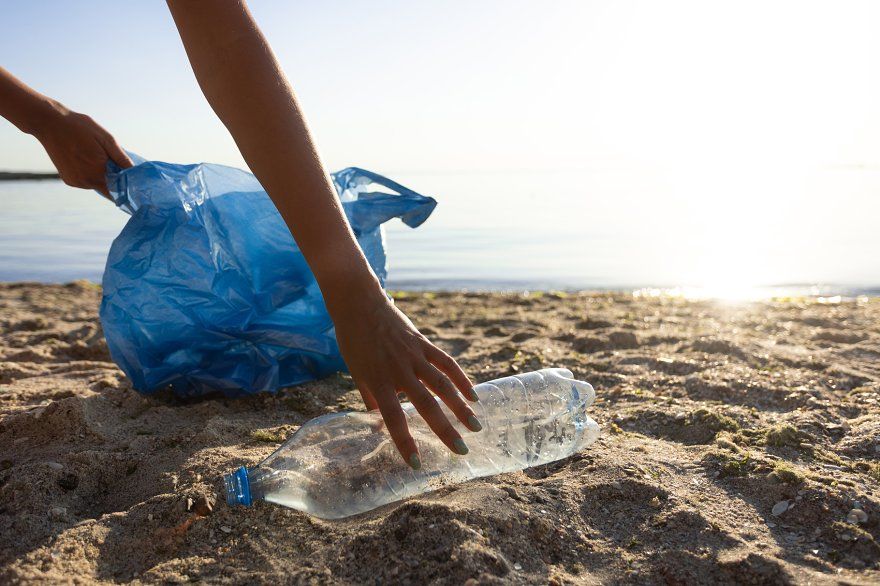 Volunteer Picking Up Wasted Plastic