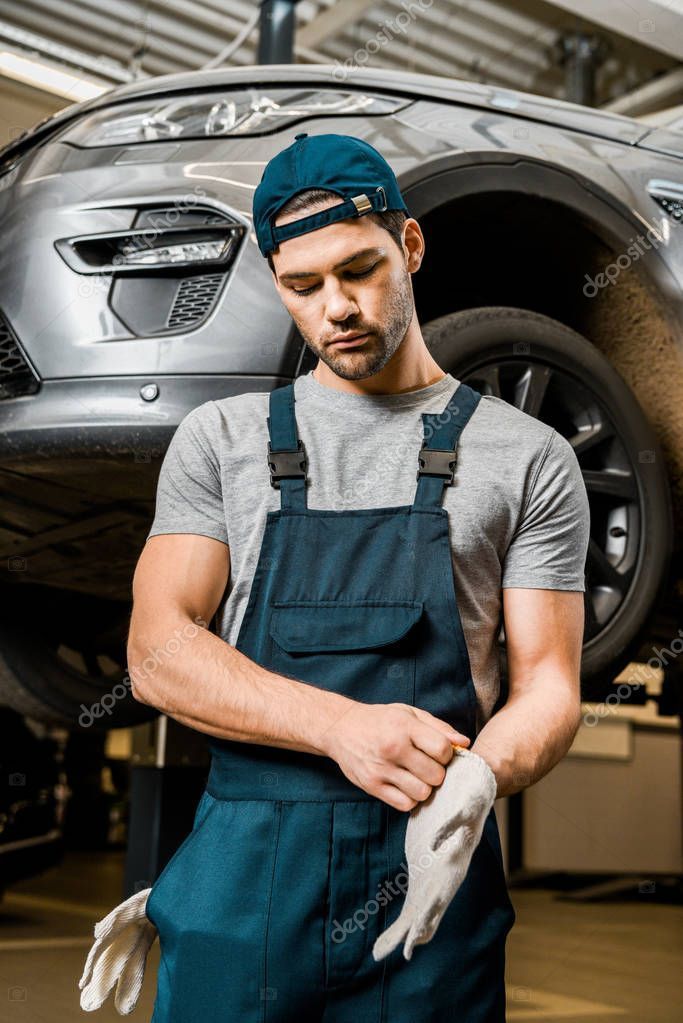 Portrait Auto Mechanic Uniform Wearing Protective Gloves Auto Repair Shop